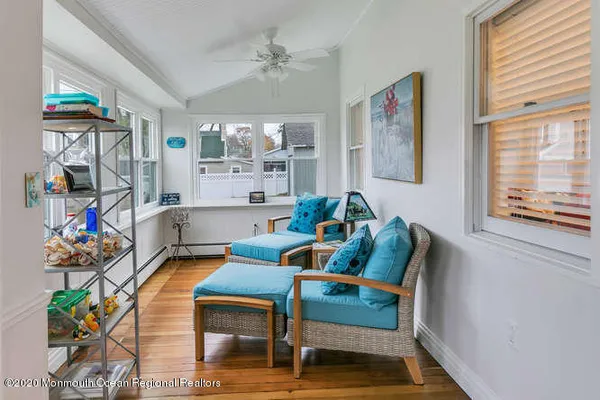 a living room with furniture fireplace and a window