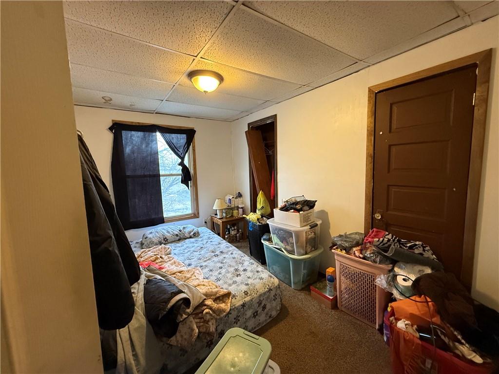 328 West Cunningham Street Butler, PA 16001 - Photo 12 of 16 a bedroom with furniture and a potted plant