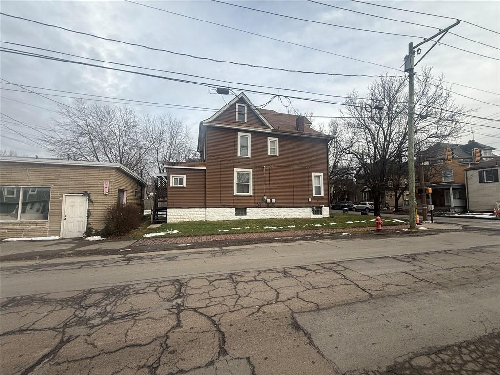 328 West Cunningham Street Butler, PA 16001 - Photo 5 of 16 a front view of a house with a yard and a garage