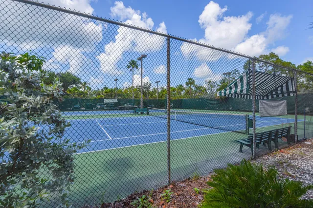 a view of a room with chairs and a chandelier
