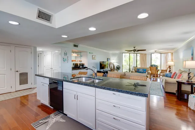 a kitchen with sink and cabinets