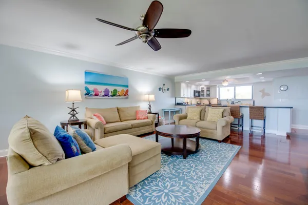 a living room with furniture and a rug