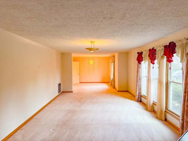 a view of a hallway with a chandelier