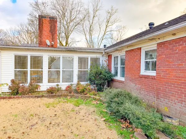 a view of a house with swimming pool and porch