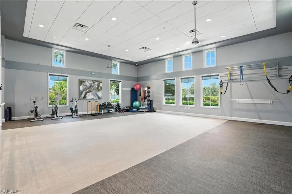 9175 Cayman Drive Naples, FL 34114 - Photo 28 of 31 a view of a livingroom with furniture window and a garage