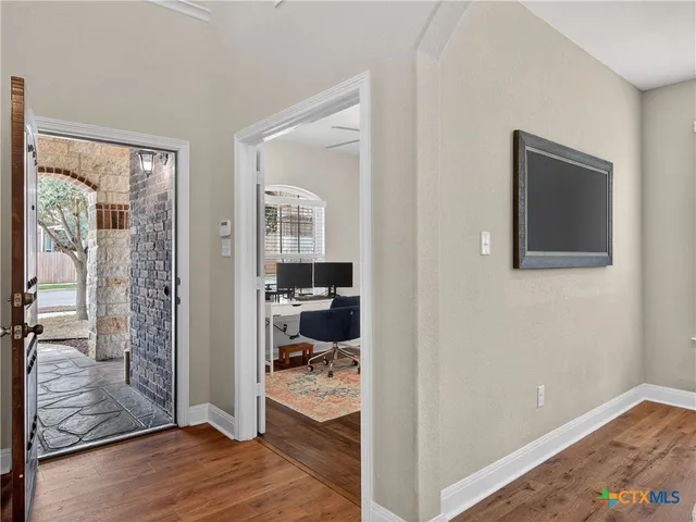 a view of a bedroom from a hallway