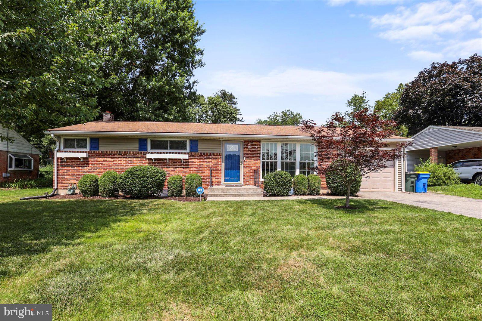 front view of a house with a garden