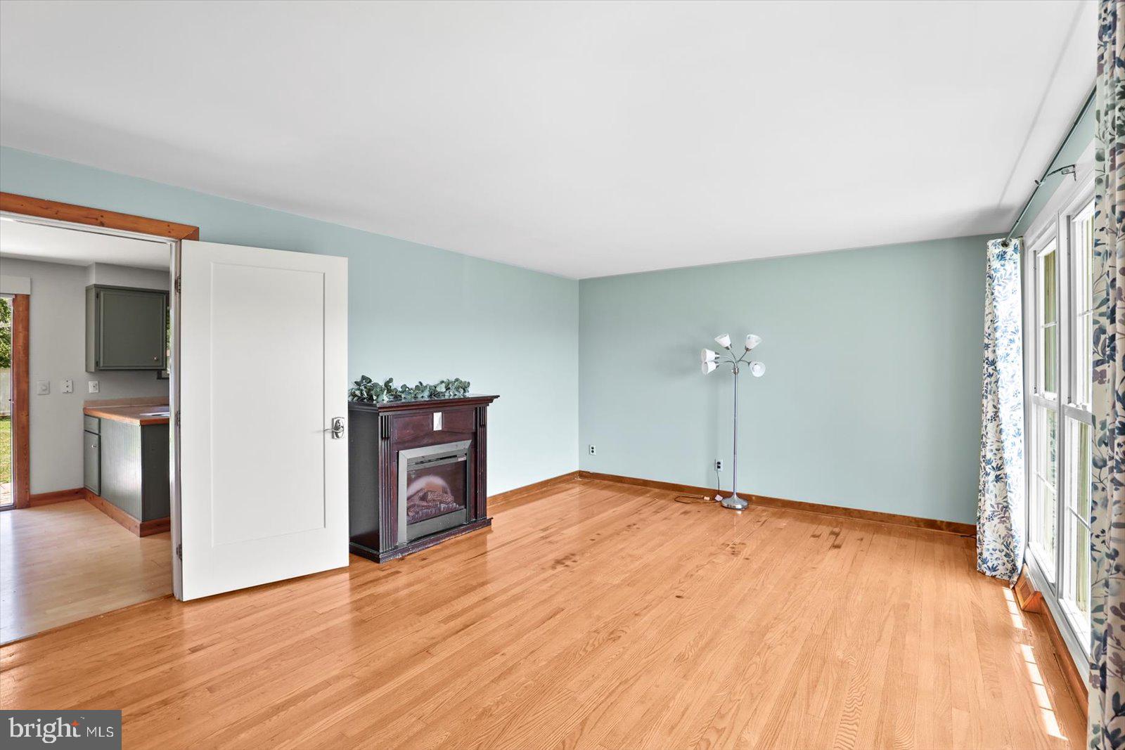 2453 Brookside Lane York, PA 17402 - Photo 12 of 40 wooden floor in an empty room with a window