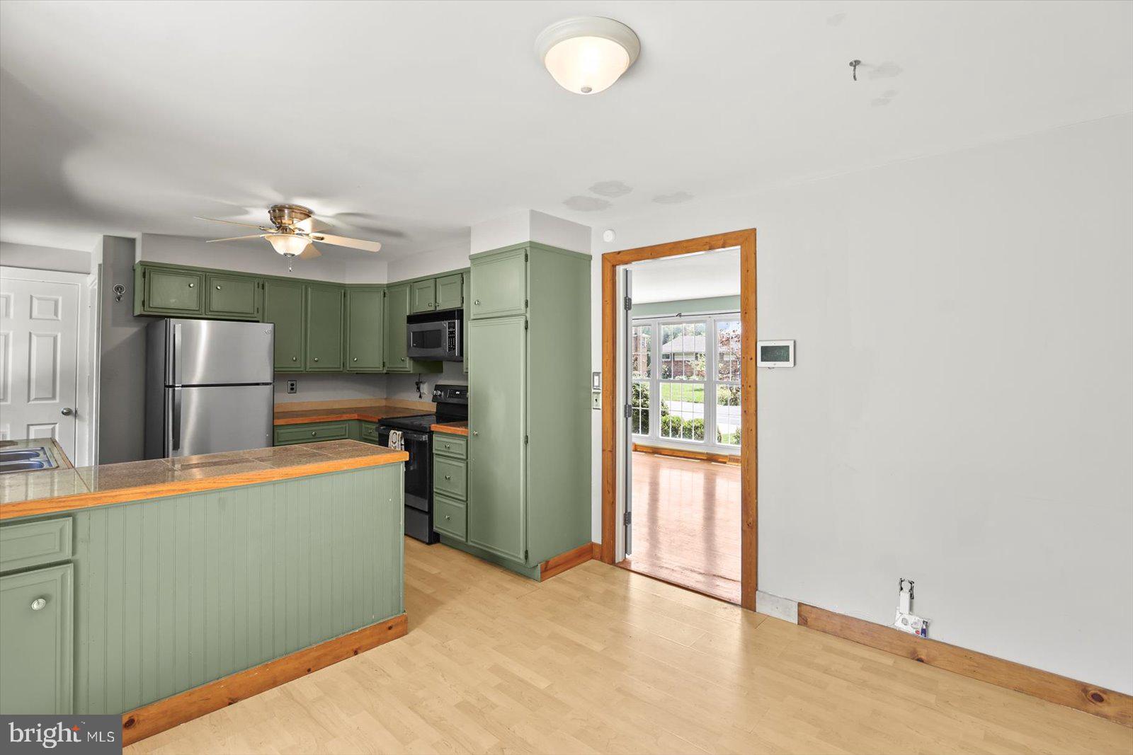 2453 Brookside Lane York, PA 17402 - Photo 15 of 40 a kitchen with refrigerator and window