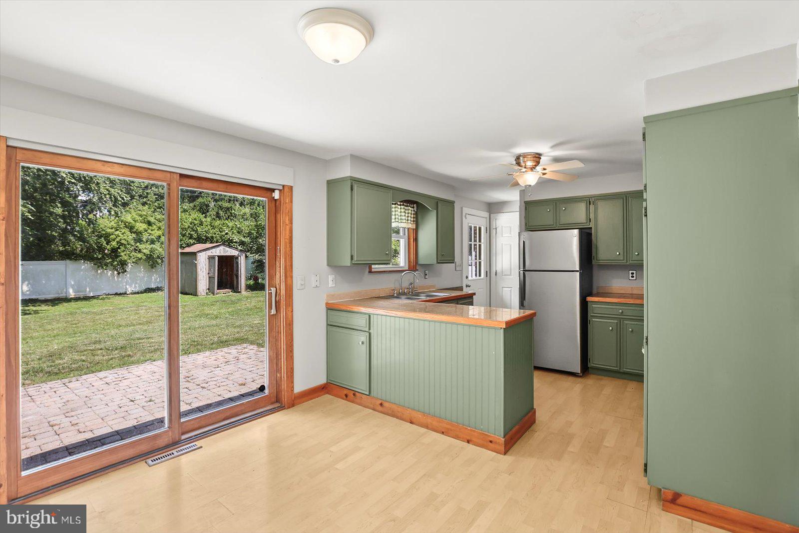 2453 Brookside Lane York, PA 17402 - Photo 16 of 40 a kitchen with a refrigerator and countertop