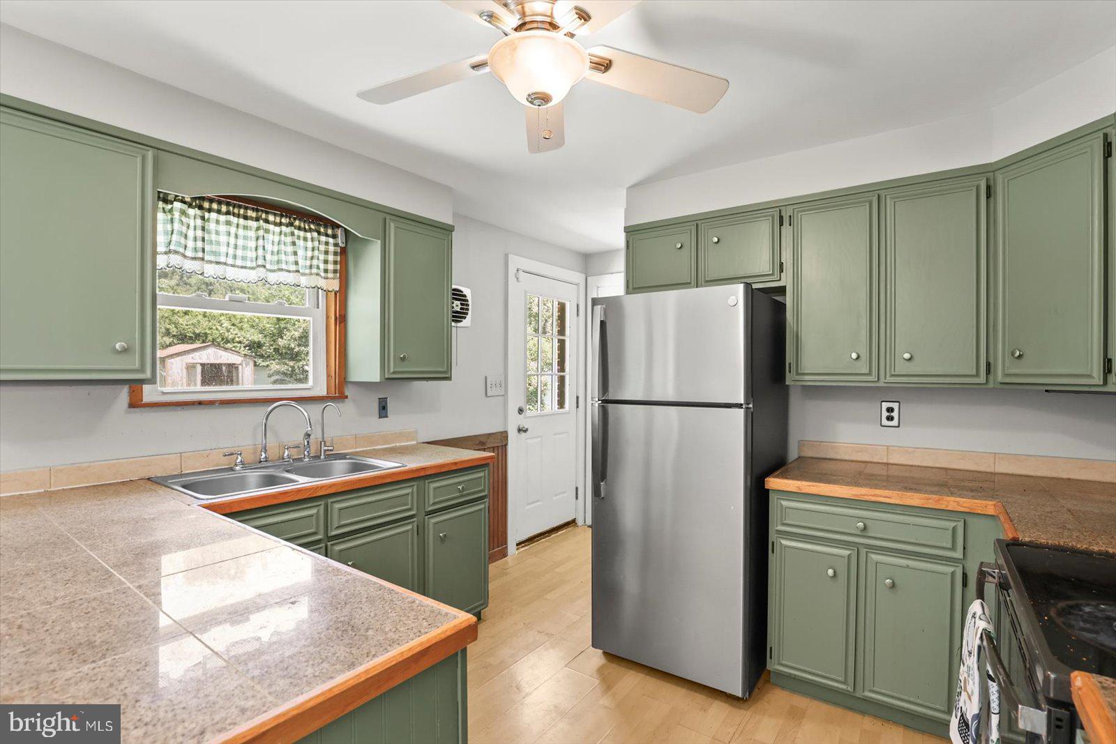 2453 Brookside Lane York, PA 17402 - Photo 18 of 40 a kitchen with a refrigerator and a sink