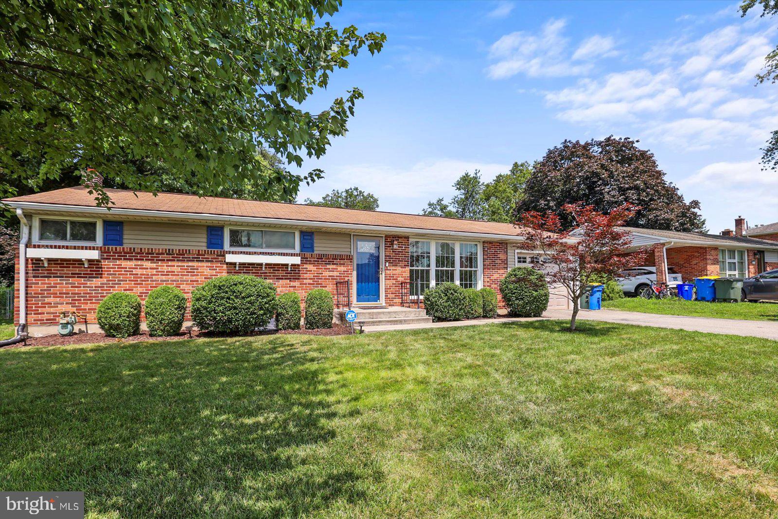 2453 Brookside Lane York, PA 17402 - Photo 2 of 40 a front view of house with yard and green space