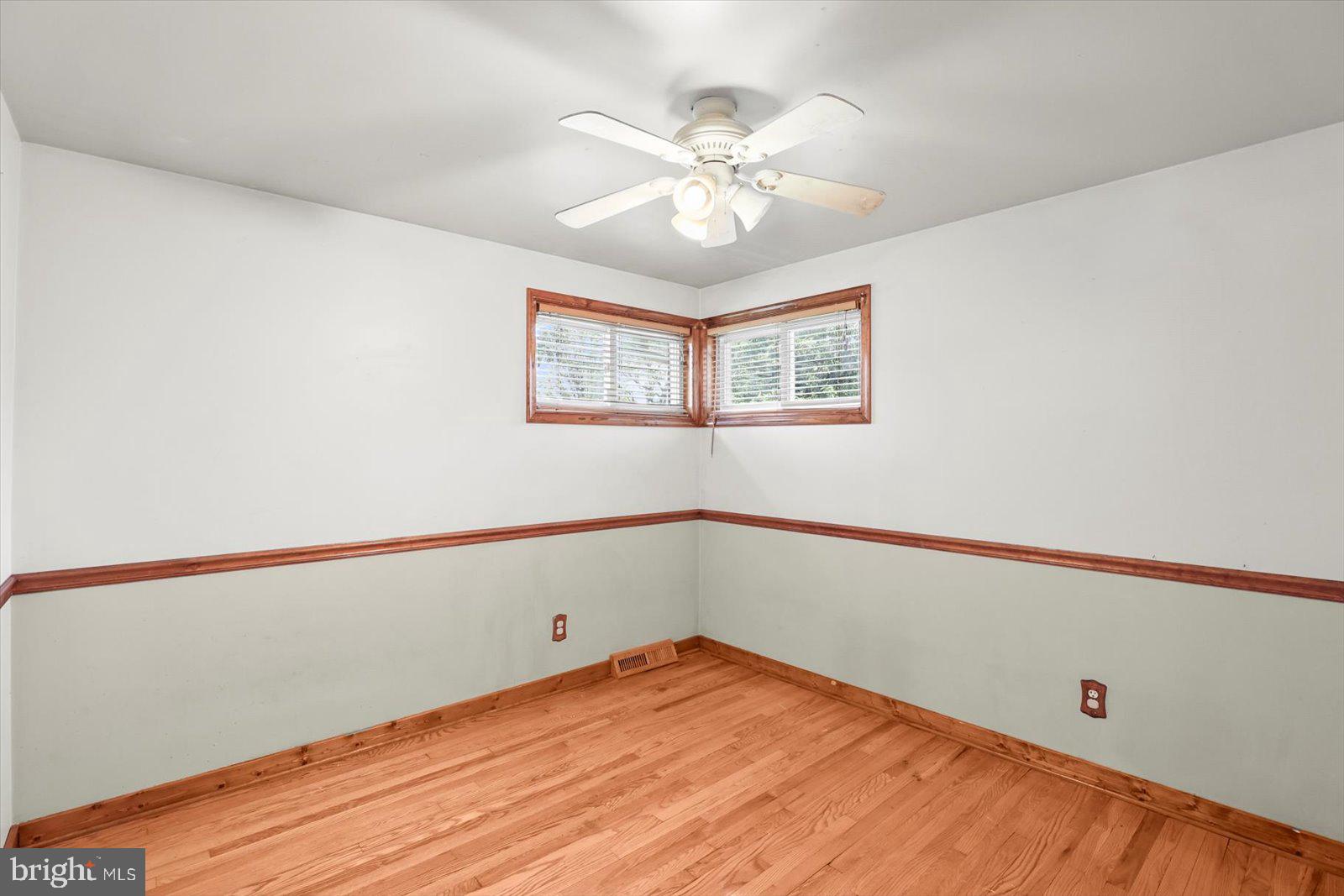 2453 Brookside Lane York, PA 17402 - Photo 22 of 40 a view of a room with wooden floor and chandelier fan