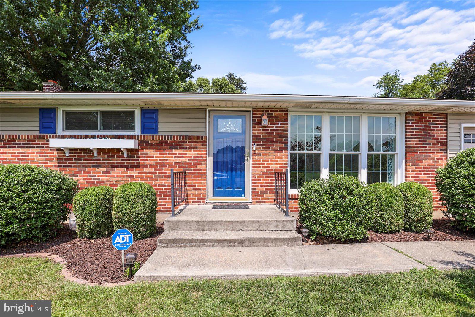 2453 Brookside Lane York, PA 17402 - Photo 3 of 40 front view of a house with a yard