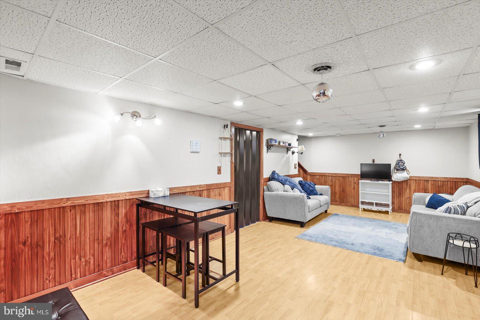 2453 Brookside Lane York, PA 17402 - Photo 31 of 40 a living room with furniture and a chandelier
