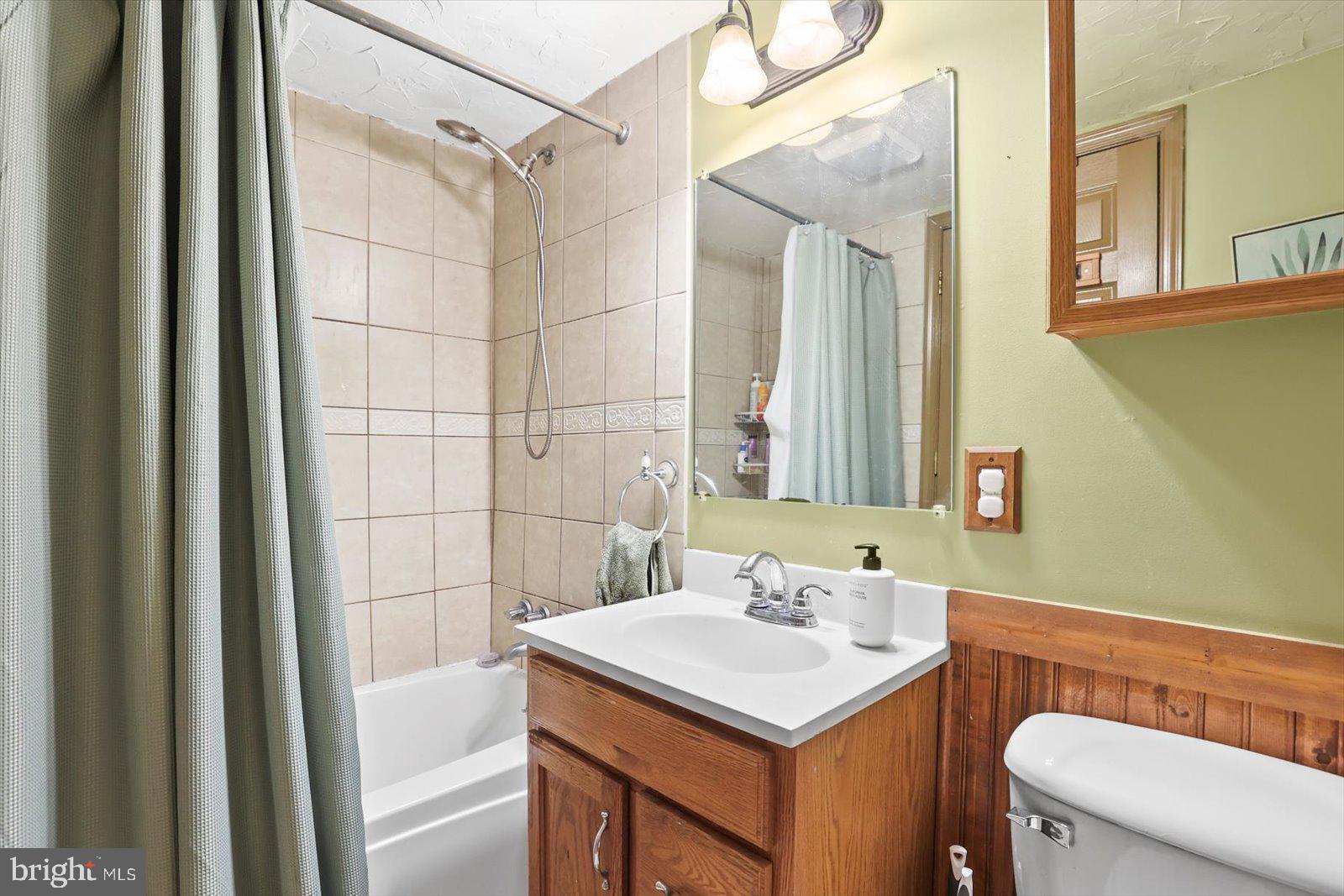 2453 Brookside Lane York, PA 17402 - Photo 32 of 40 a bathroom with a sink a toilet and shower