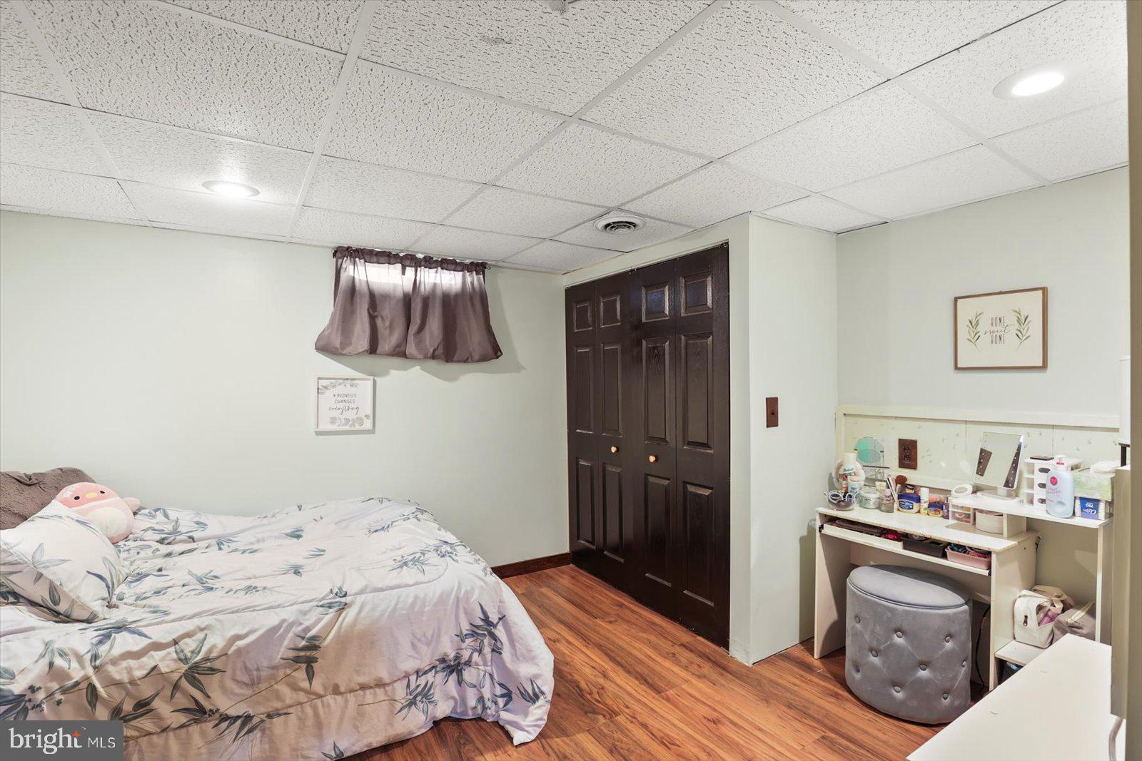 2453 Brookside Lane York, PA 17402 - Photo 33 of 40 a bedroom with a bed and wooden floor