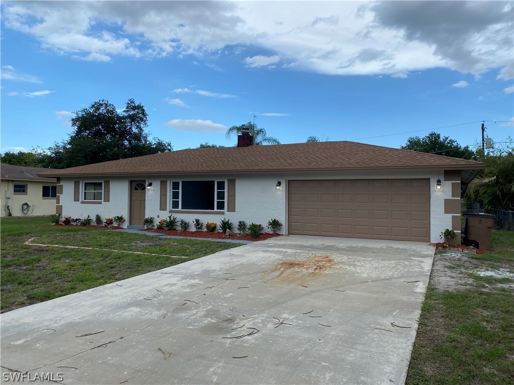 2316 Lotus Road Fort Myers, FL 33905 - Photo 1 of 35 front view of a house with a garden