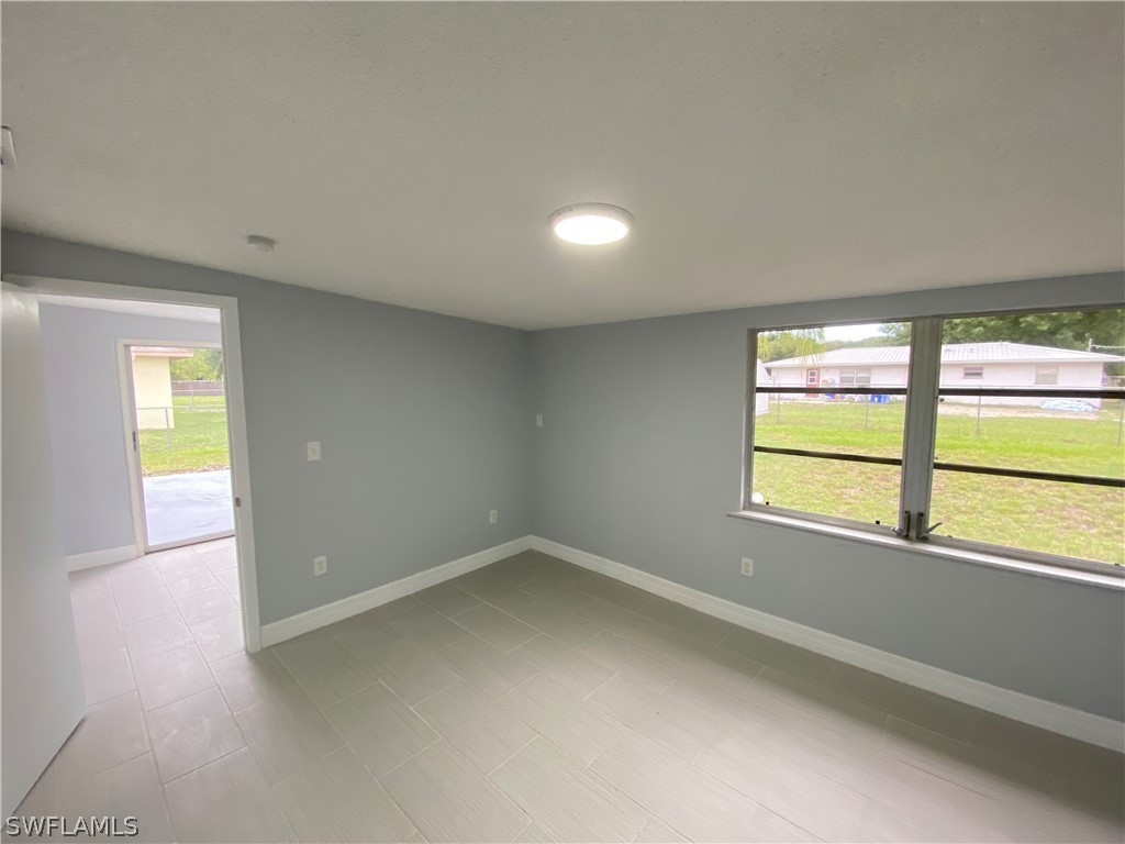 2316 Lotus Road Fort Myers, FL 33905 - Photo 17 of 35 an empty room with a window