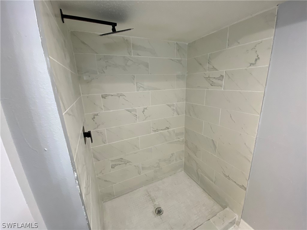 2316 Lotus Road Fort Myers, FL 33905 - Photo 29 of 35 a bathroom with a shower