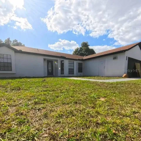 a view of backyard and kitchen