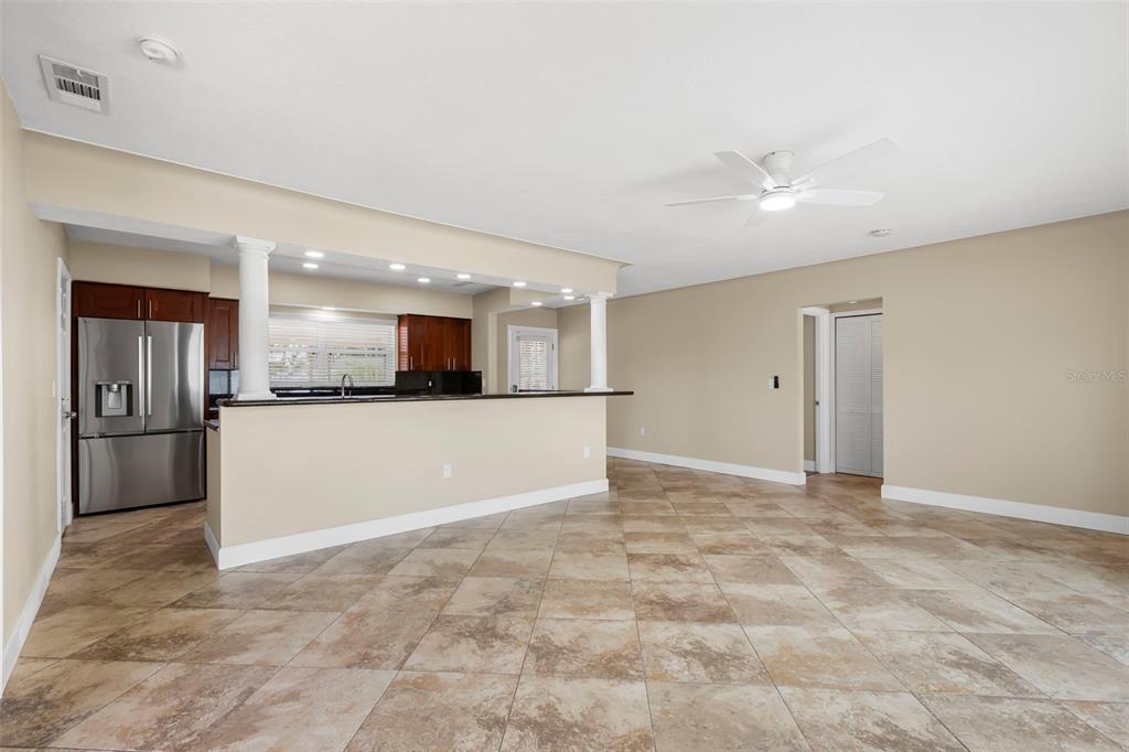 708 Sunset Cove Madeira Beach, FL 33708 - Photo 20 of 61 a view of a kitchen with a sink and a refrigerator