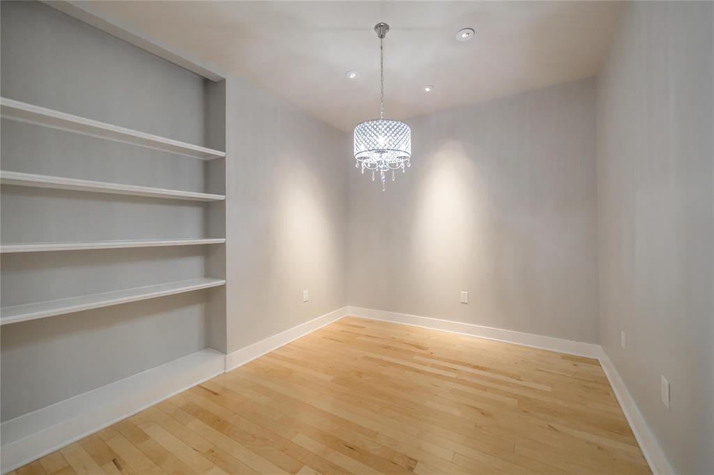 4414 Cedar Springs Road, Unit 214 Dallas, TX 75219 - Photo 3 of 29 Unfurnished dining area featuring light wood-style floors, a chandelier, and recessed lighting
