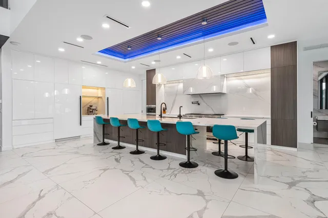 a bedroom with a large bed and a flat tv screen