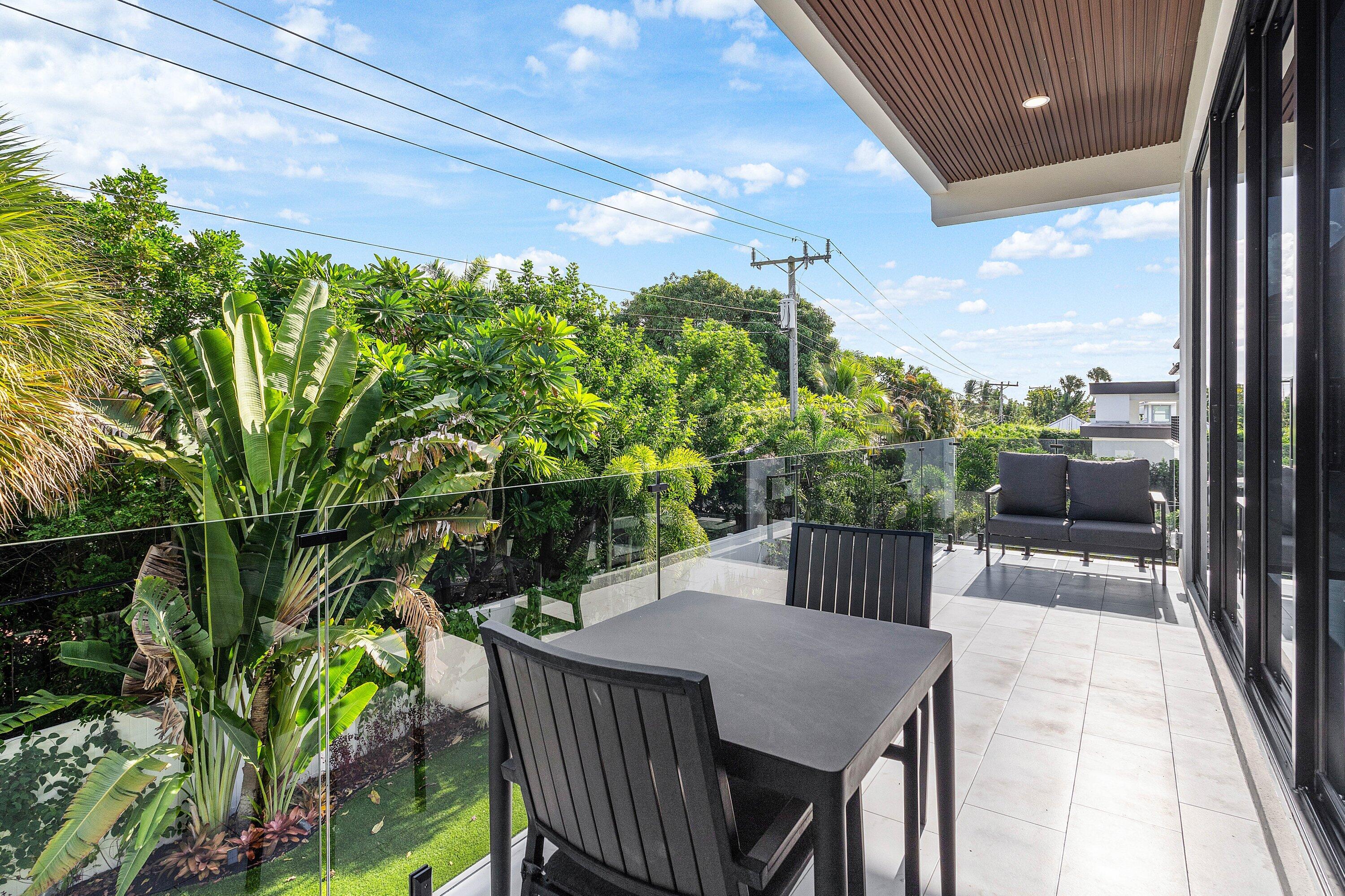 245 Northeast 6th Court Boca Raton, FL 33432 - Photo 32 of 84 a outdoor view with a sitting space