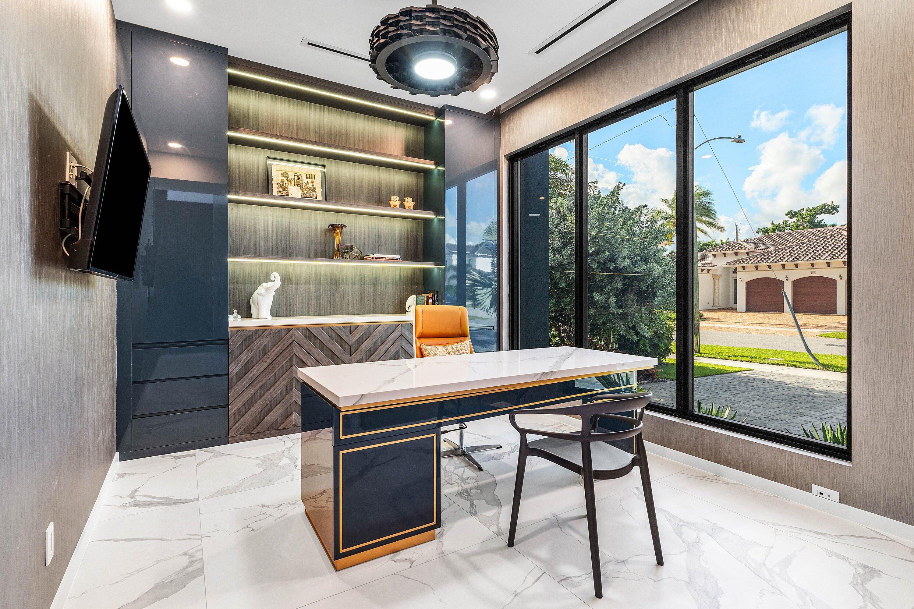 245 Northeast 6th Court Boca Raton, FL 33432 - Photo 39 of 84 a reading room with furniture and a large window