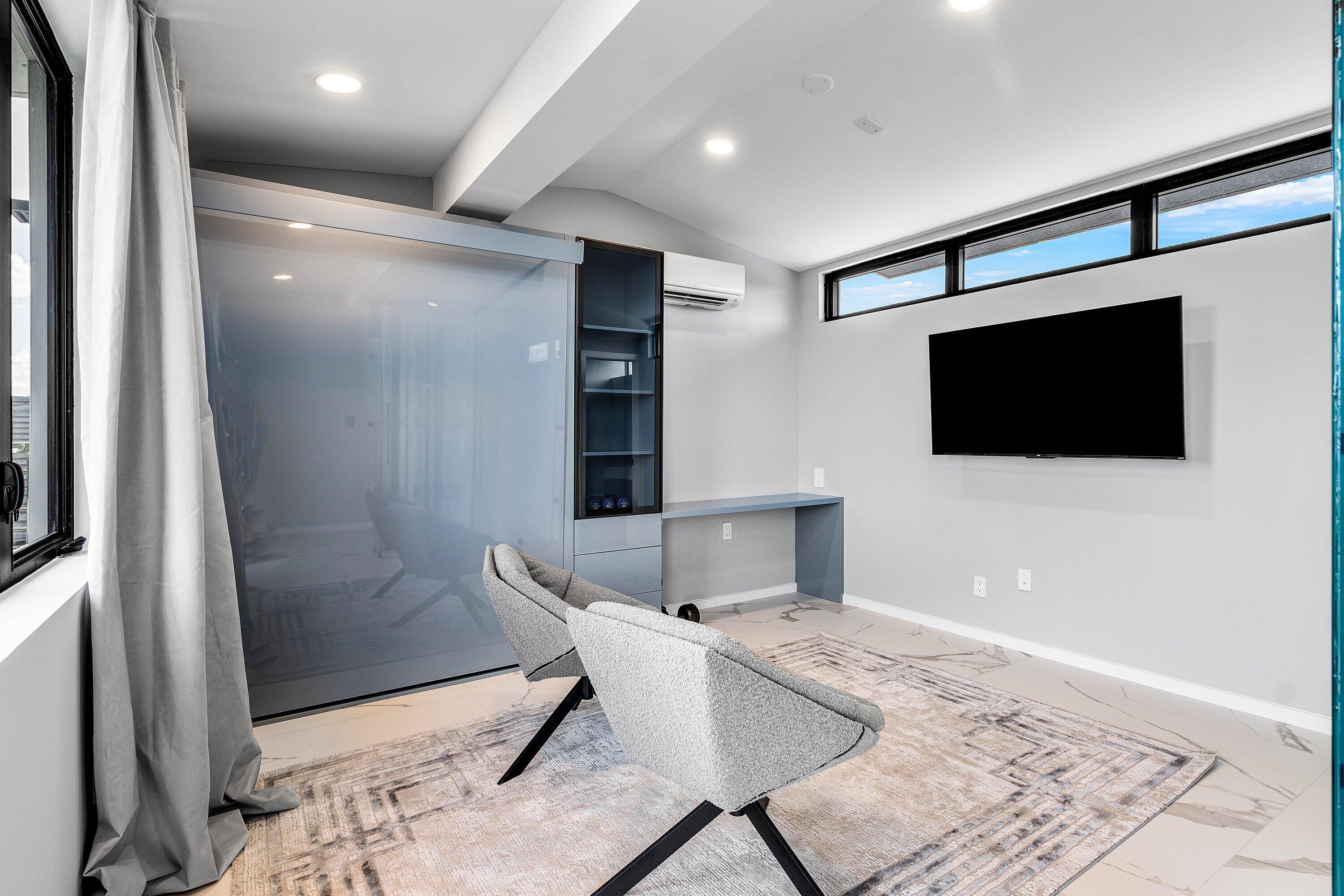 245 Northeast 6th Court Boca Raton, FL 33432 - Photo 41 of 84 a living room with furniture and a flat screen tv