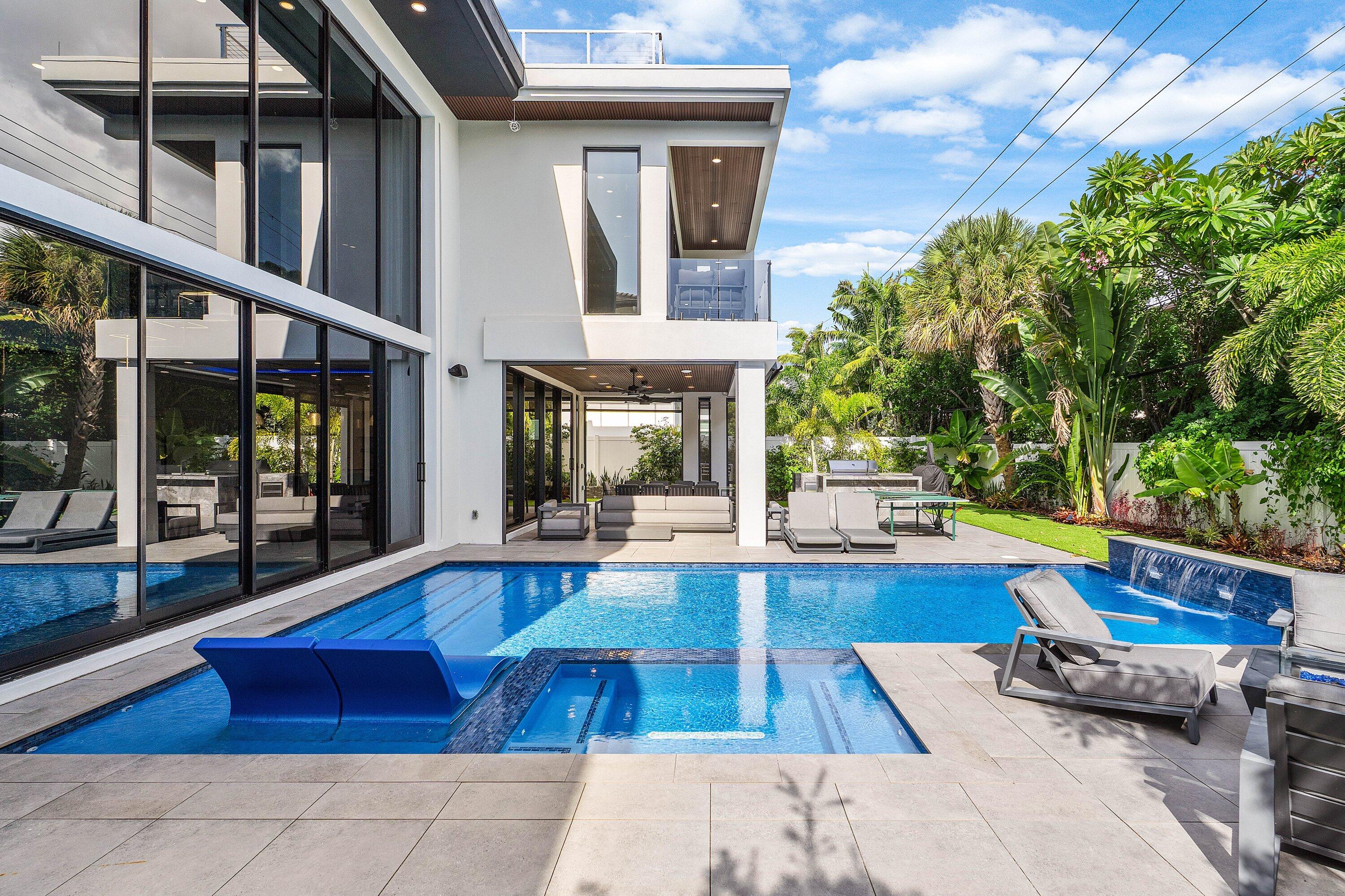 245 Northeast 6th Court Boca Raton, FL 33432 - Photo 49 of 84 a view of a house with swimming pool and sitting area
