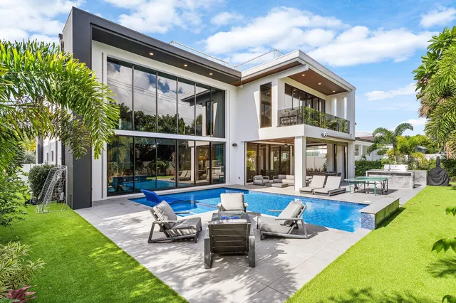 an aerial view of residential houses with outdoor space