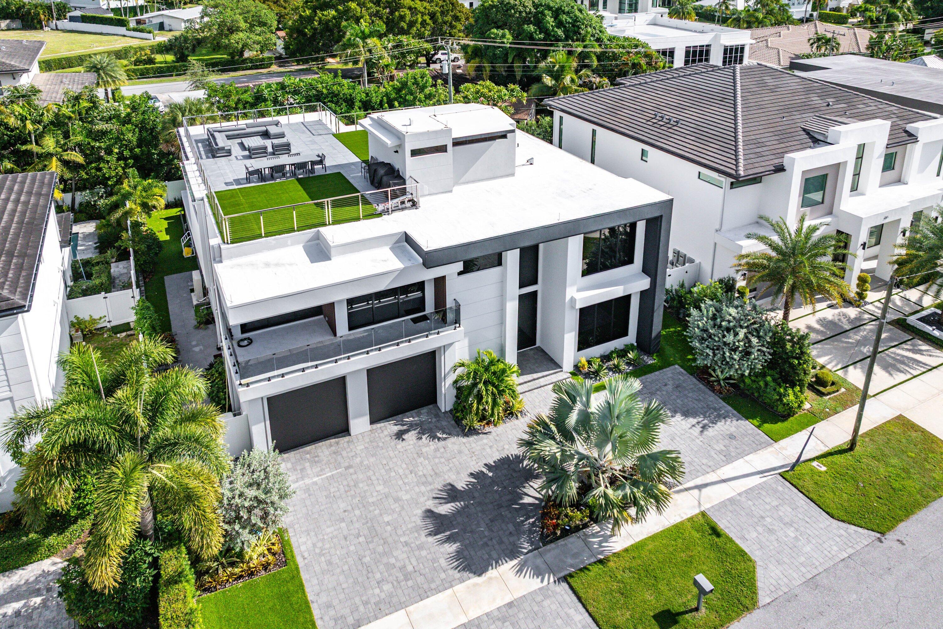245 Northeast 6th Court Boca Raton, FL 33432 - Photo 58 of 84 an aerial view of a house with a yard