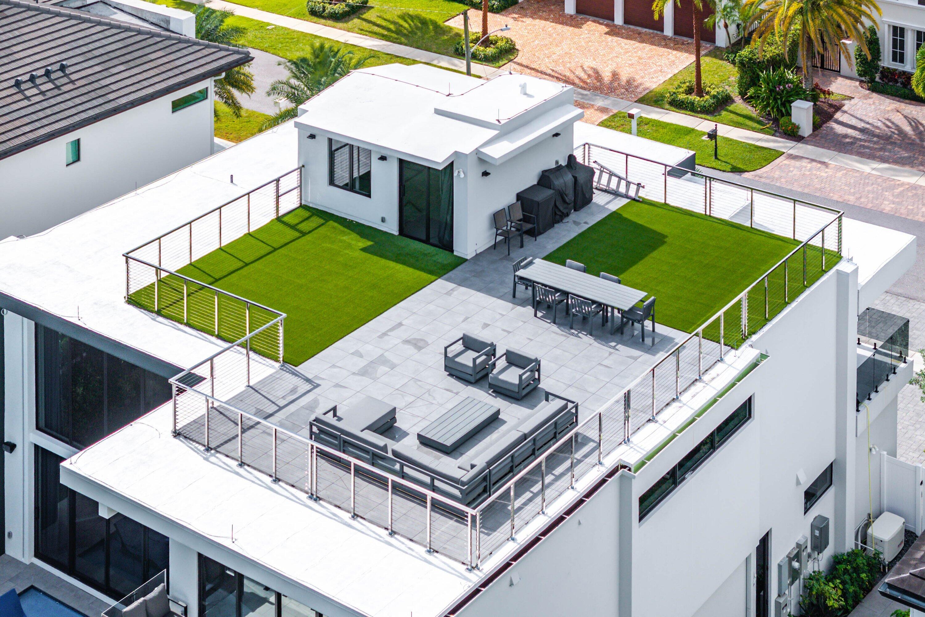 245 Northeast 6th Court Boca Raton, FL 33432 - Photo 60 of 84 a aerial view of a house with roof deck