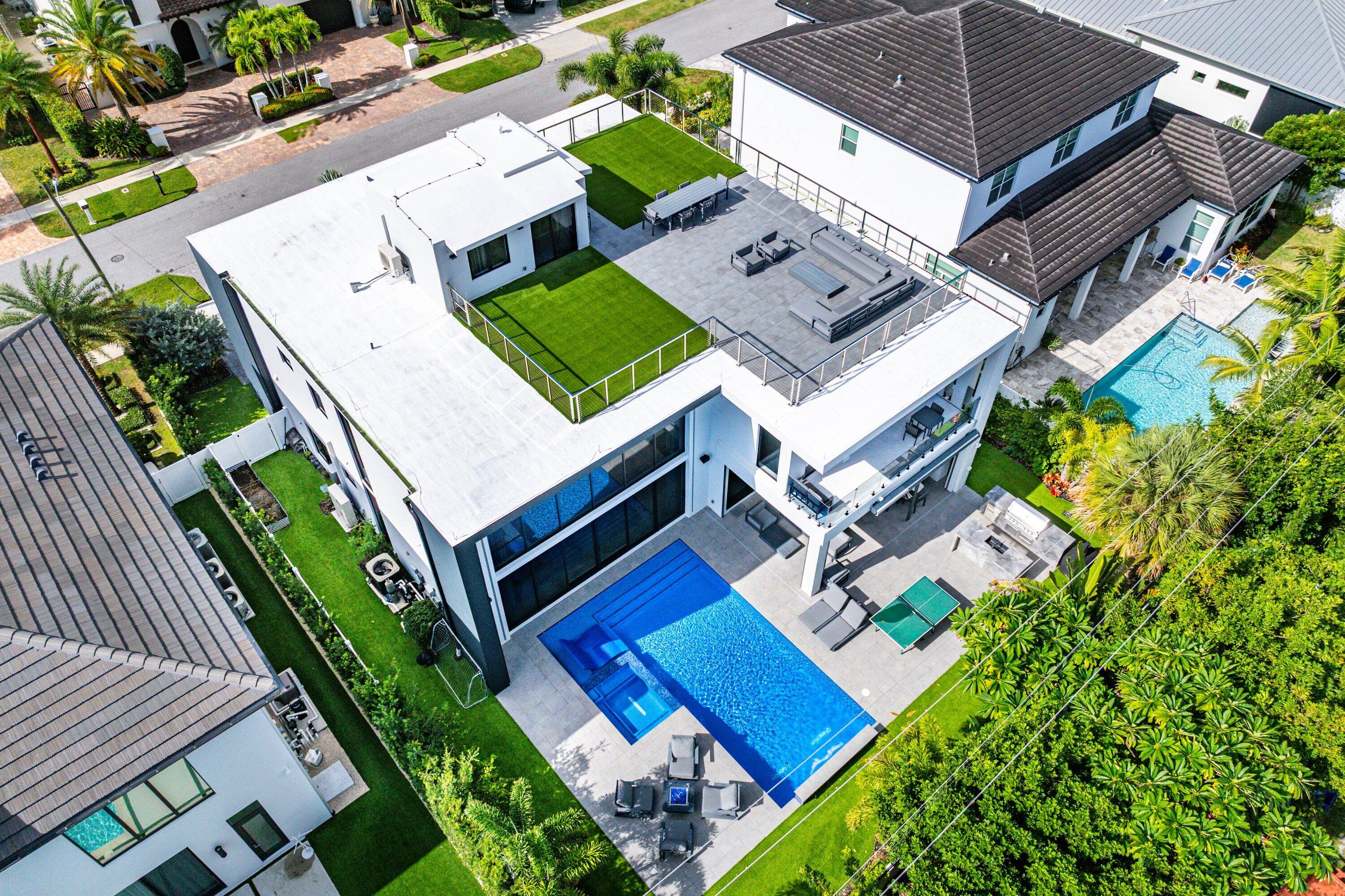 245 Northeast 6th Court Boca Raton, FL 33432 - Photo 62 of 84 an aerial view of a house with a garden