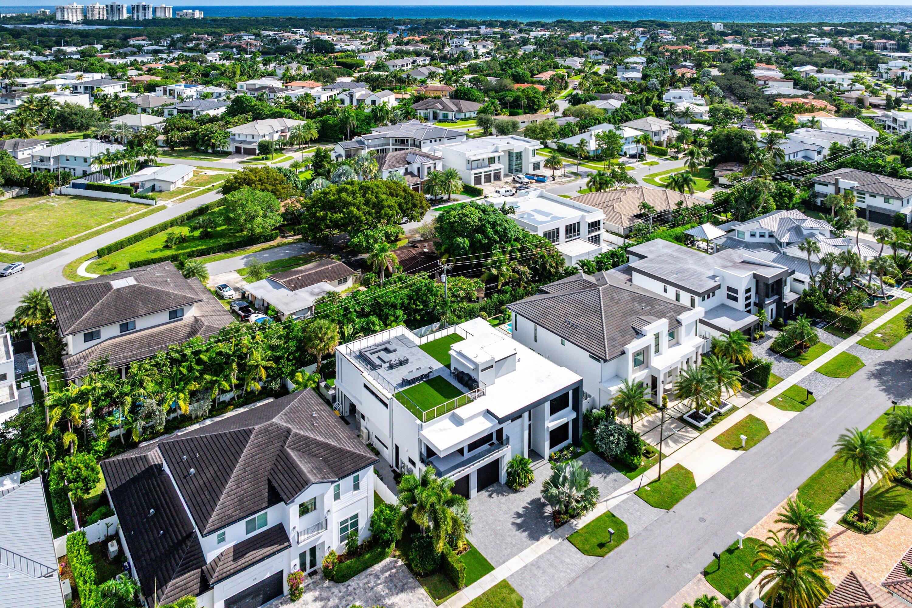 245 Northeast 6th Court Boca Raton, FL 33432 - Photo 67 of 84 an aerial view of a house with a swimming pool yard and outdoor seating