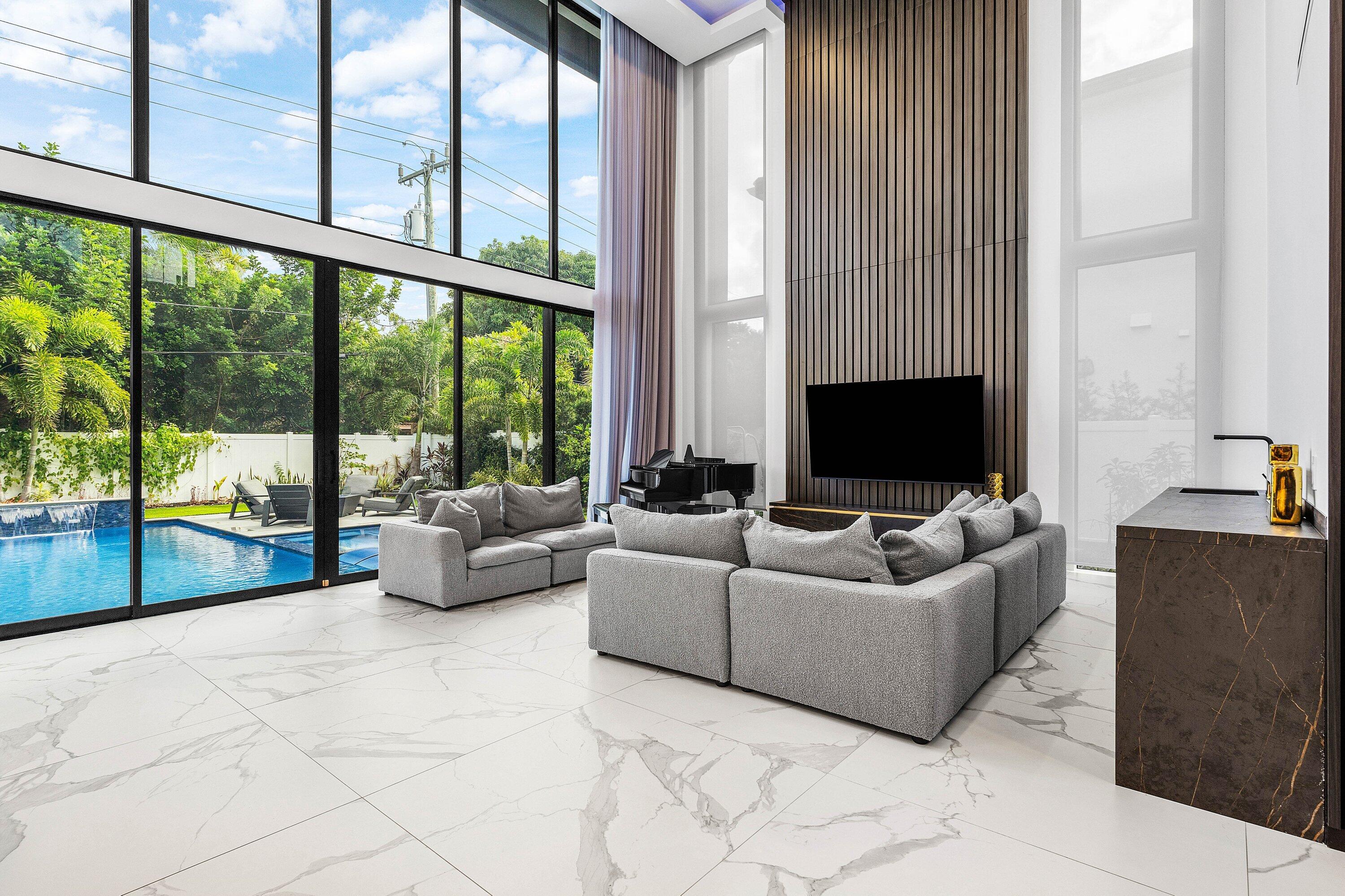 245 Northeast 6th Court Boca Raton, FL 33432 - Photo 7 of 84 a living room with furniture and a flat screen tv