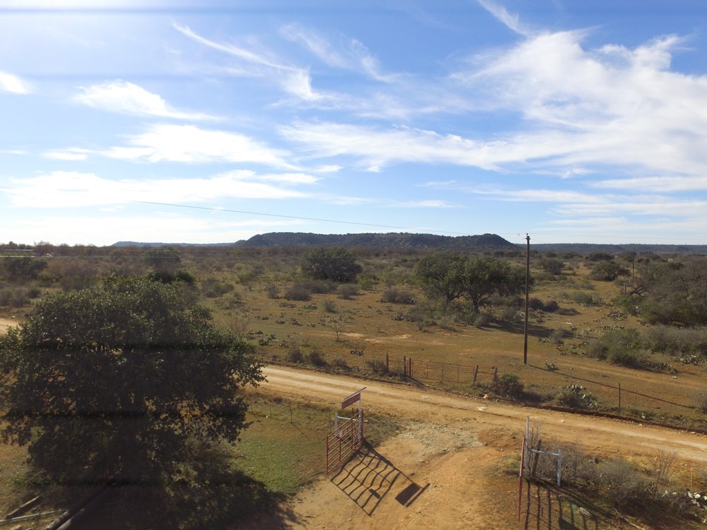 17167 Mill Creek Road Mason, TX 76856 - Photo 2 of 14 a view of a lake with mountain