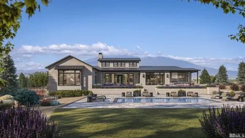a front view of a house with a yard table and chairs