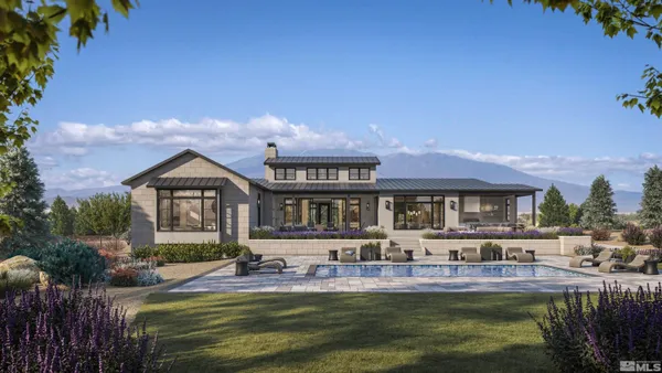 a front view of a house with a yard table and chairs