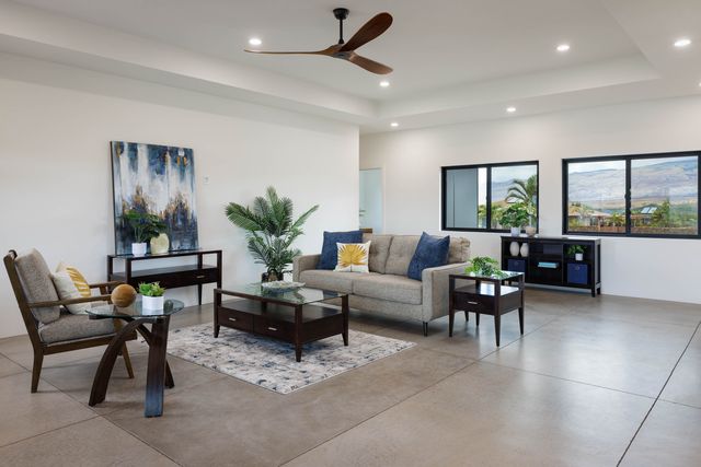 a living room with furniture and windows