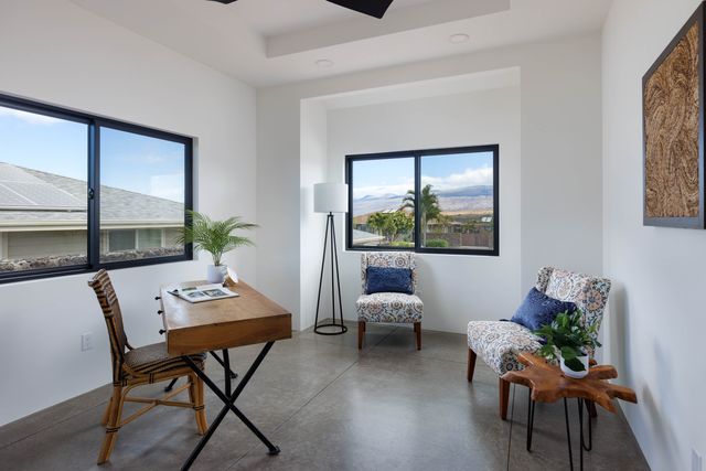 a workspace with furniture and a window