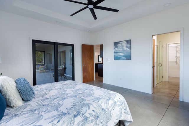 a bedroom with a bed and cabinets