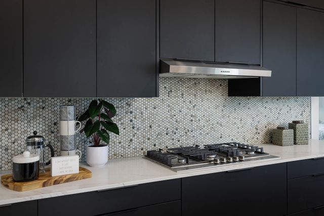 a kitchen with a sink and cabinets