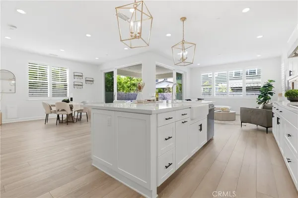 a dining room with furniture and wooden floor