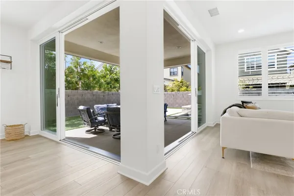 a view of a patio with table and chairs and potted plants