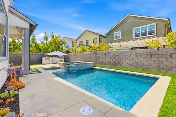 a view of house with backyard