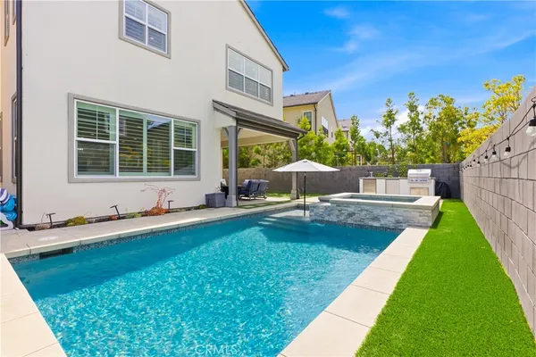 a view of a house with a yard porch and sitting area
