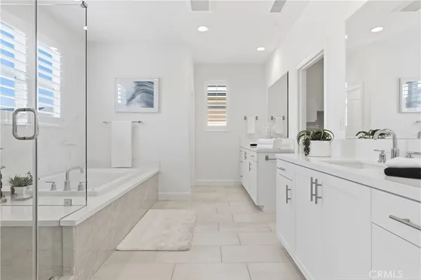 a bathroom with a granite countertop sink a toilet and a large mirror